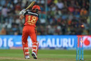 Royal Challengers Bangalore captain and batsman Virat Kohli looks on as he is bowled out during the final Twenty20 cricket match of the 2016 Indian Premier League (IPL) between Royal Challengers Bangalore and Sunrisers Hyderabad at The M. Chinnaswamy Stadium in Bangalore on May 29, 2016. / GETTYOUT / ----IMAGE RESTRICTED TO EDITORIAL USE - STRICTLY NO COMMERCIAL USE----- / AFP PHOTO / MANJUNATH KIRAN