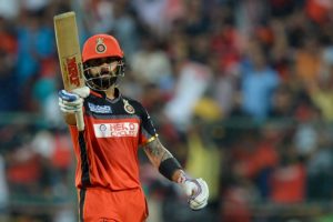 Royal Challengers Bangalore captain and batsman Virat Kohli raises his bat after scoring 50 runs during the final Twenty20 cricket match of the 2016 Indian Premier League (IPL) between Royal Challengers Bangalore and Sunrisers Hyderabad at The M. Chinnaswamy Stadium in Bangalore on May 29, 2016. / GETTYOUT / ----IMAGE RESTRICTED TO EDITORIAL USE - STRICTLY NO COMMERCIAL USE----- / AFP PHOTO / MANJUNATH KIRAN