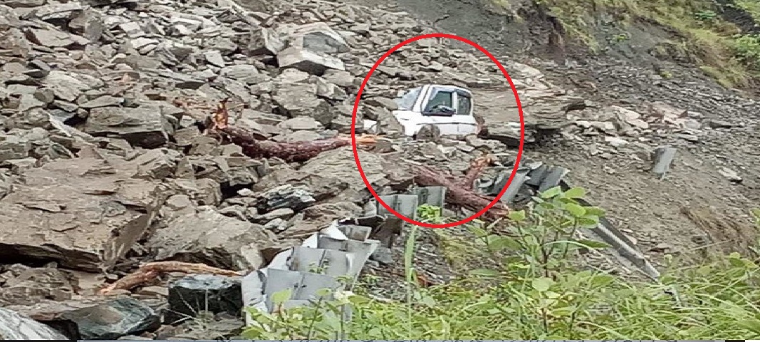 Car buried in heavy debris from hill on Badrinath highway
