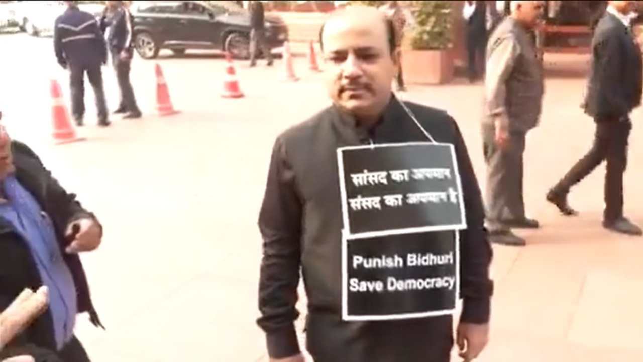MP Danash Ali was seen protesting during the winter session with a placard hanging around his neck.