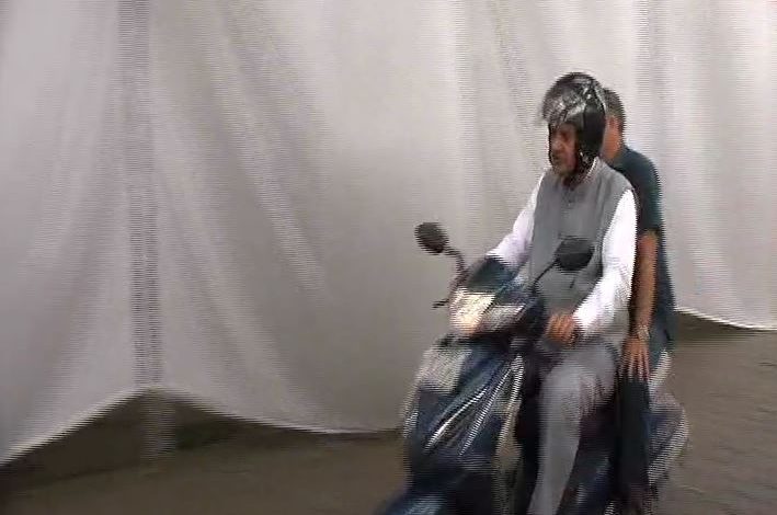 following-pm-modis-call-minister-ganesh-joshi-arrived-camp-office-riding-two-wheeler